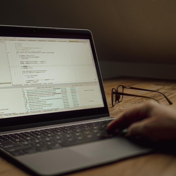 Mobile app project planning workspace with devices and development tools